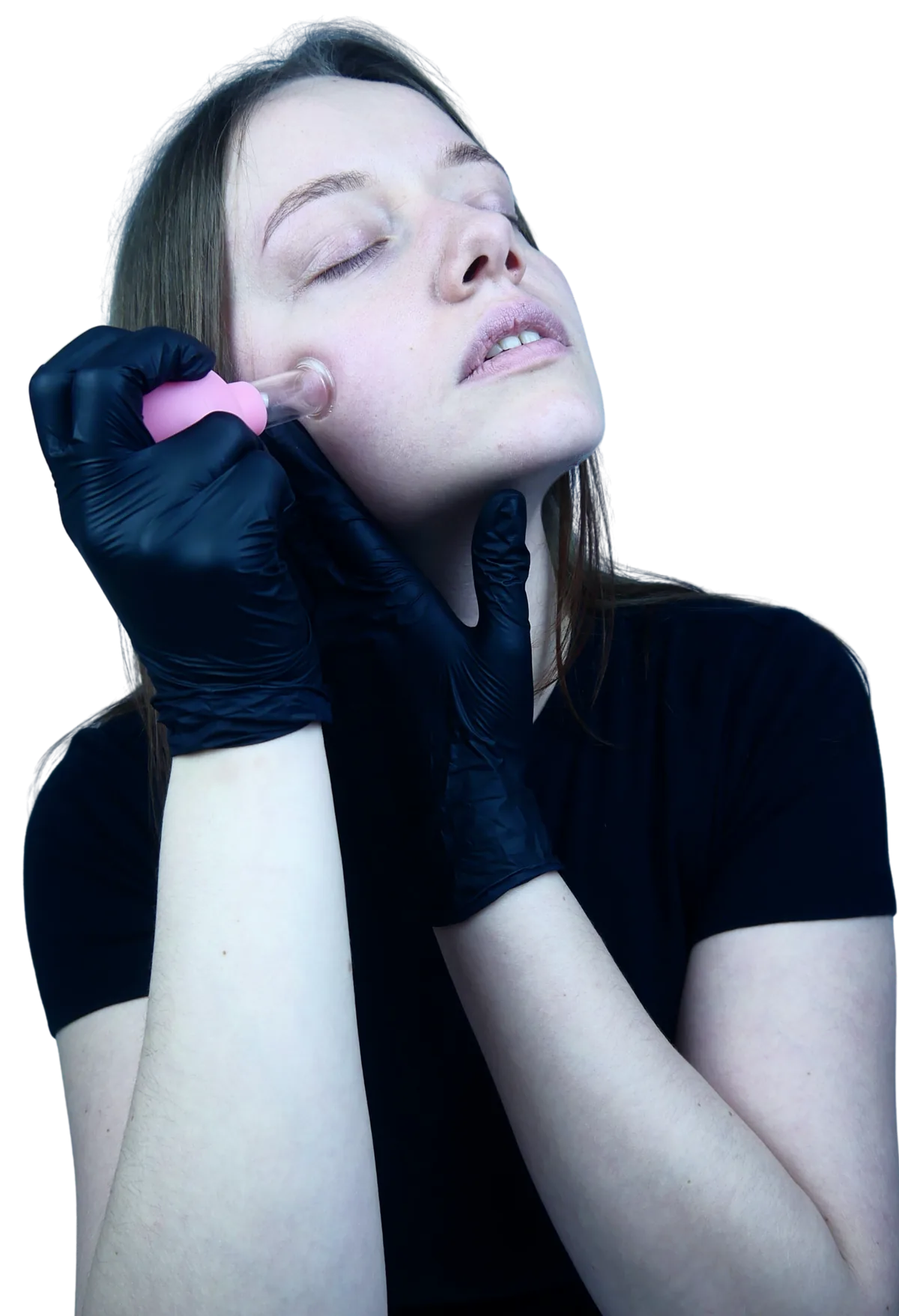Maja applying a small cupping cup to her cheek