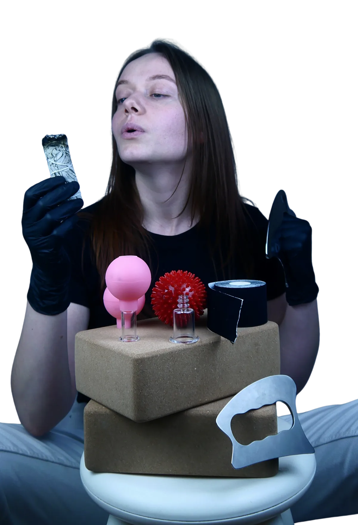 Maja with her massage tools: cupping cups, spiky ball, tape and a cork block